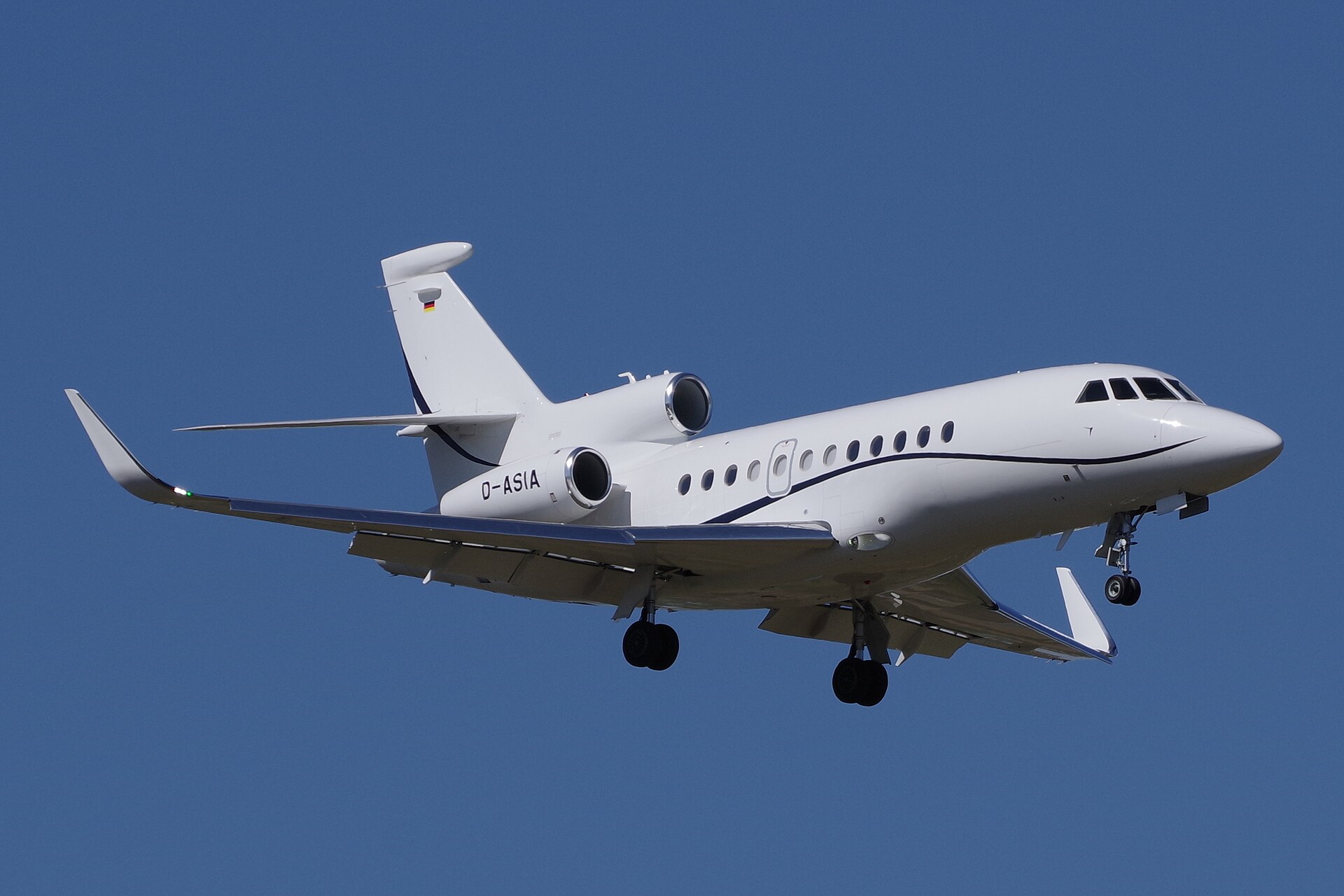 Dassault Falcon 900LX business jet landing at an airport