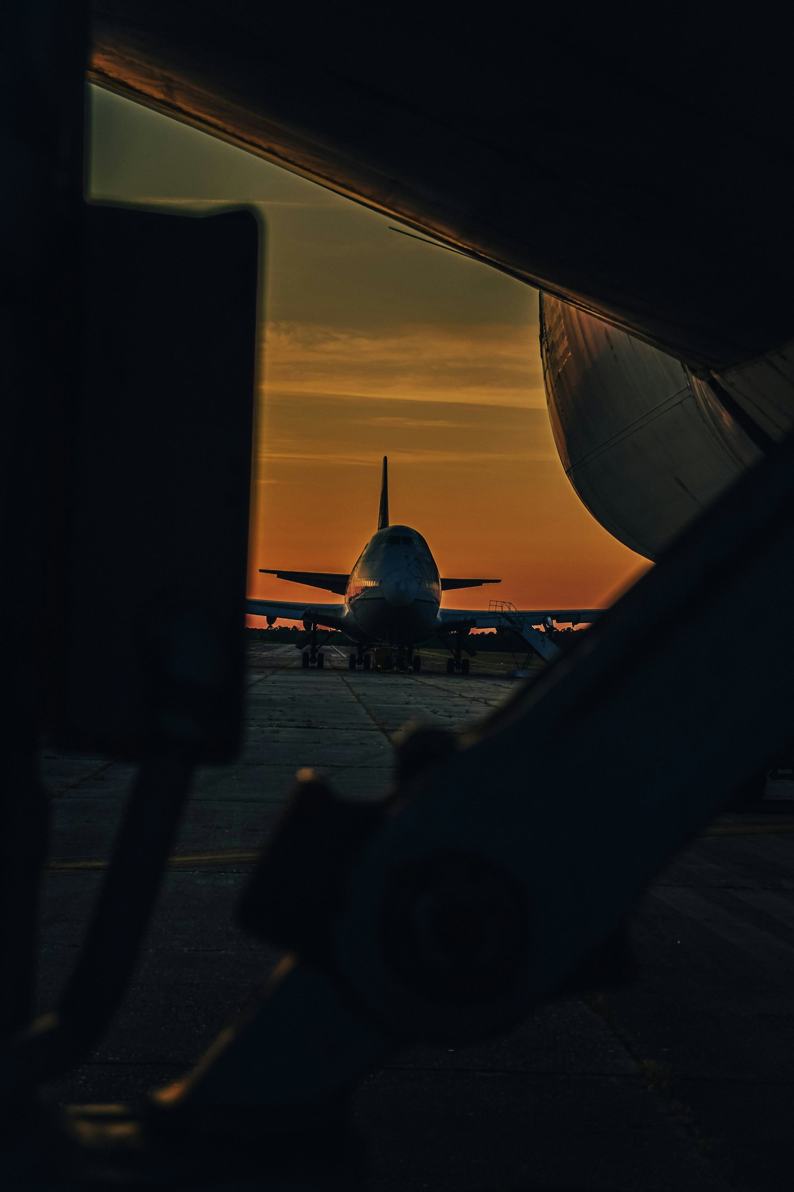 Business jet on a runway at sunset