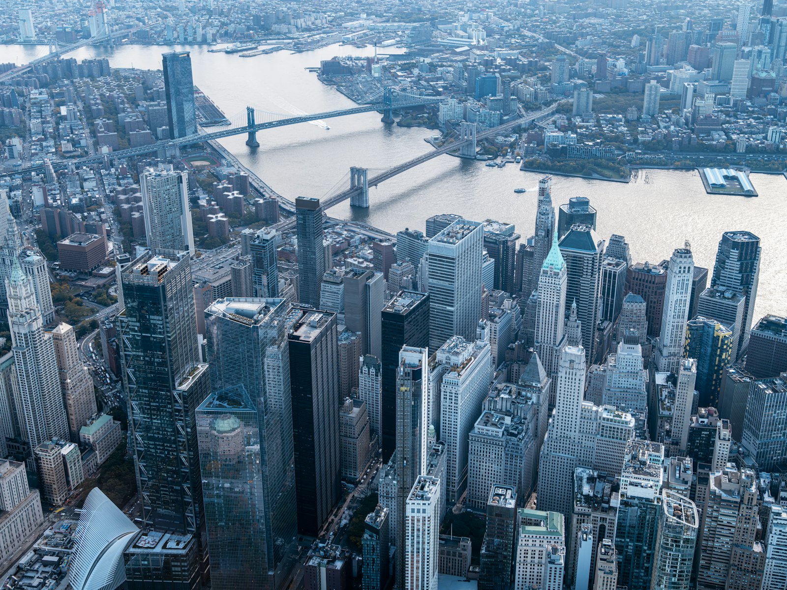 Aerial view of Lower Manhattan and a bridge, shot from a helicopter