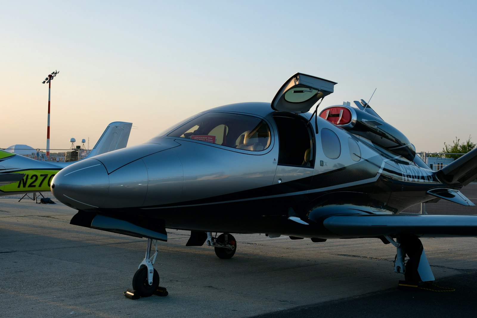 Modern private jet parked on an airport tarmac