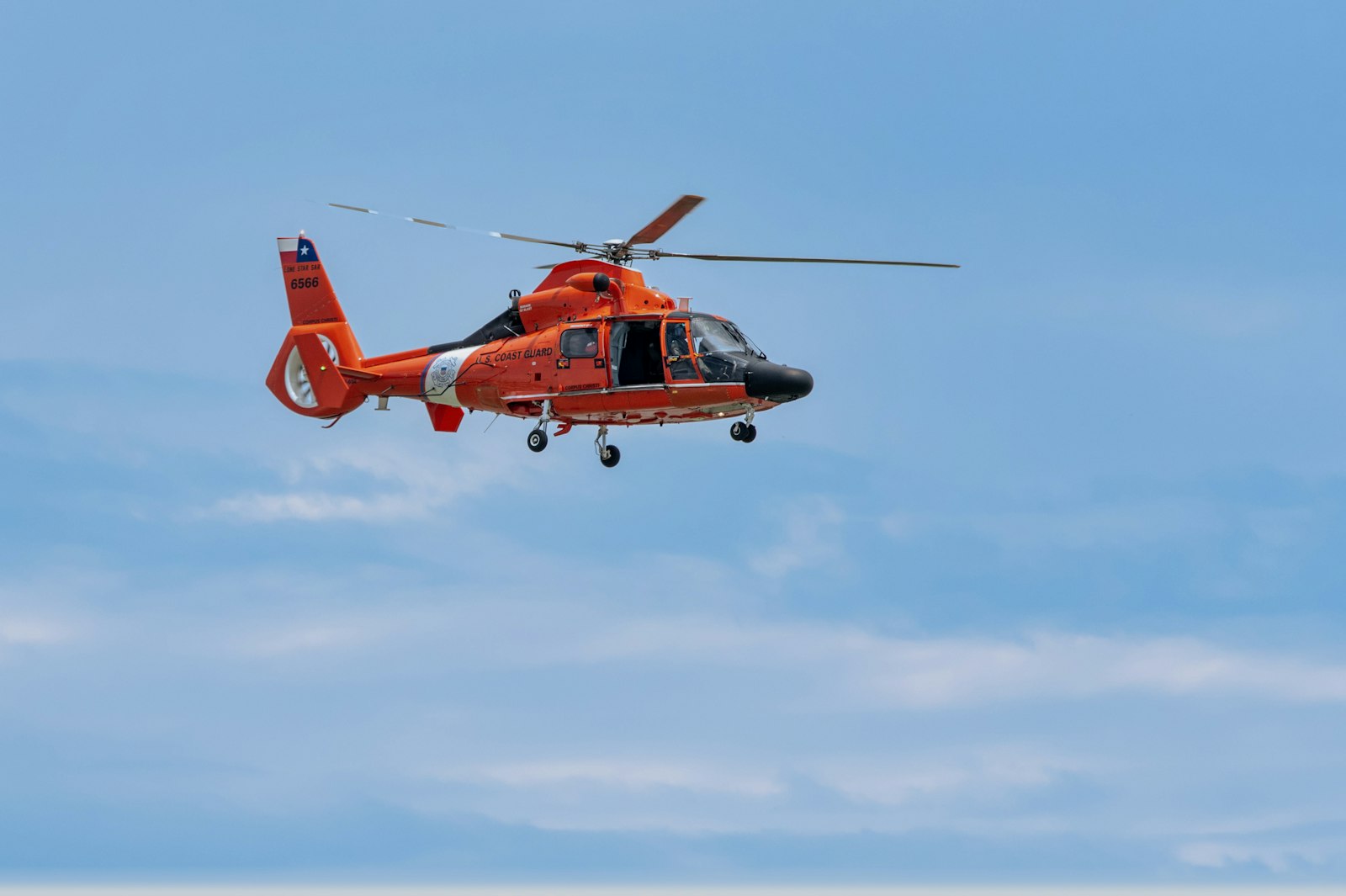 Red helicopter in flight